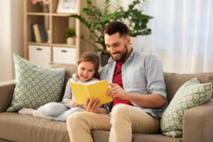 Dad and Child Reading Together